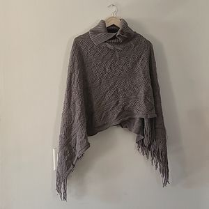 Earthbound grey knitted poncho.